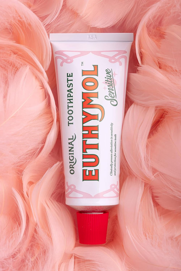 Euthymol Toothpaste Sensitive 75ml in a pit of feathers