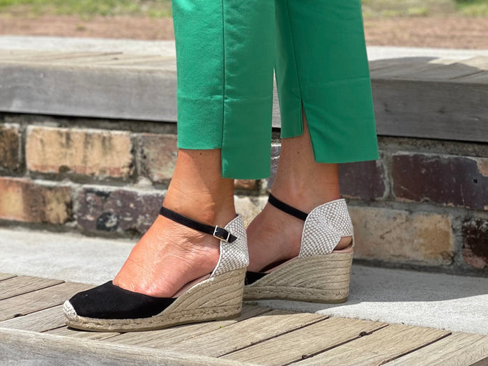 Quality Spanish espadrille sandals made from black coloured suede leather. Comfortable, wedge jute sole unit. Enclosed ankle strap and enclosed toe.
