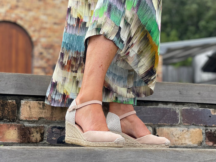 Quality Spanish espadrille sandals made from blush coloured suede leather. Comfortable, wedge jute sole unit. Enclosed ankle strap and enclosed toe.