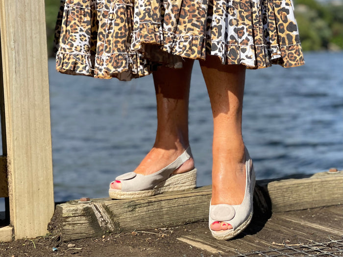 Stone coloured espadrille wedge sandals with a button detail at the toe and a jute sole unit. Spanish women's footwear and shoes.