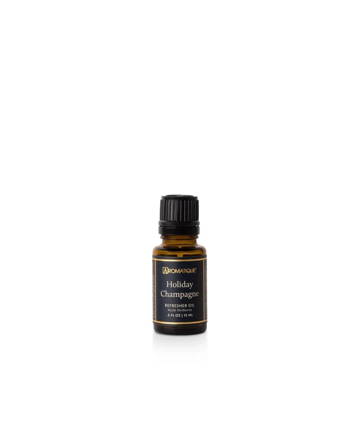Aromatique Holiday Champagne fragrance oil refill in amber glass bottle with black label