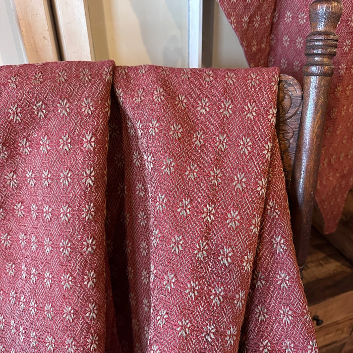 Red and tan fabric swatch in the Packsville Rose star-like pattern - Primitive Star Quilt Shop