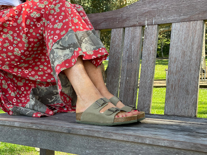 Quality European women's sandals. Made in Spain contoured cork footbed and rubber sole. Comfortable slide style sandal with double buckle detail. Birkenstock style sandal in khaki.