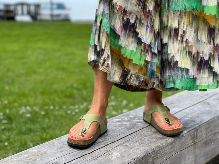 Quality European women's sandals. Made in Spain contoured cork footbed and rubber sole. Comfortable thong style sandal with buckle. Birkenstock style sandal in pistachio green.