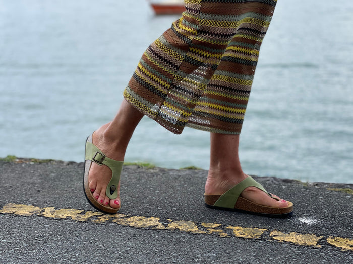 Quality European women's sandals. Made in Spain contoured cork footbed and rubber sole. Comfortable thong style sandal with buckle. Birkenstock style sandal in pistachio green.