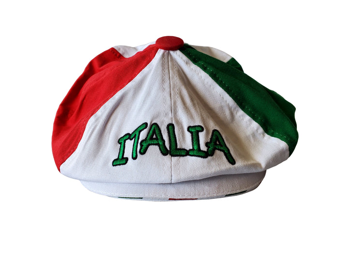 Gatsby-style cap featuring three distinct panels in red, white, and green, arranged to reflect the Italian flag. The front displays “ITALIA” embroidered in green thread on the white section, with a red button at the crown. A bold and fashionable tribute to Italian heritage and pride.